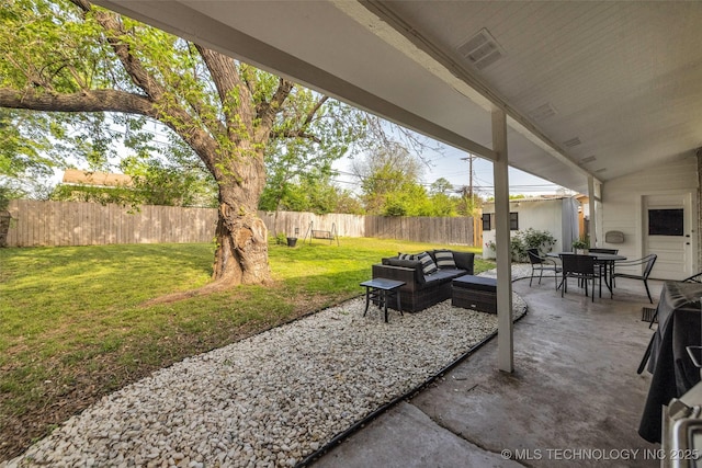 4620 S Winston Ave, Tulsa, OK 74135 - fenced backyard with an outdoor hangout area, a patio area, and outdoor dining space