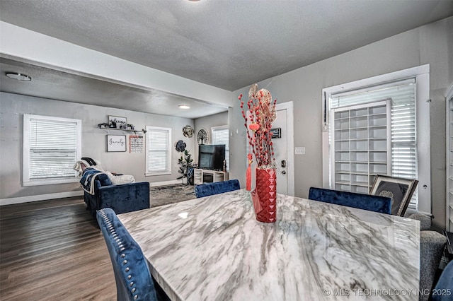 1208 NW 1st Ave, Ardmore, OK 73401 - dining room with wood finished floors and a textured ceiling