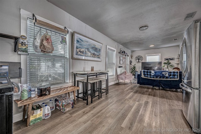 1208 NW 1st Ave, Ardmore, OK 73401 - interior space with wood finished floors and a textured ceiling