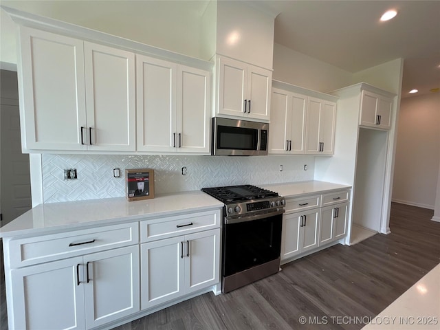 10416 E 132nd St S, Bixby, OK 74008 - kitchen featuring appliances with stainless steel finishes, white cabinets, dark wood finished floors, backsplash, and recessed lighting