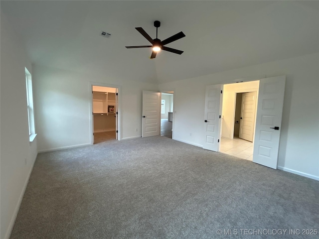 10416 E 132nd St S, Bixby, OK 74008 - unfurnished bedroom with carpet flooring, a spacious closet, lofted ceiling, a closet, and ceiling fan