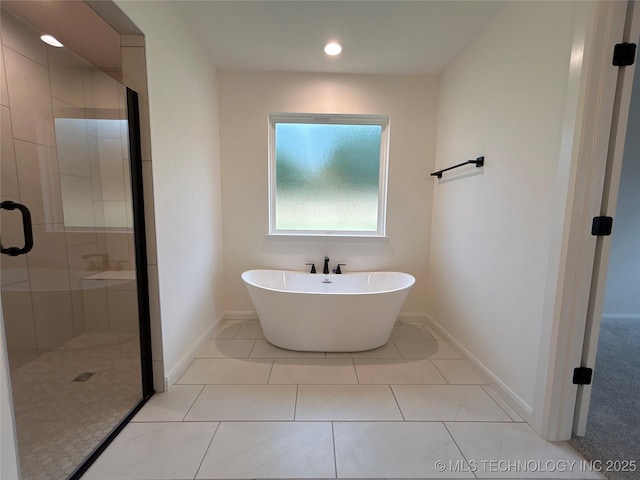 10416 E 132nd St S, Bixby, OK 74008 - bathroom with a stall shower, a freestanding tub, tile patterned floors, and recessed lighting