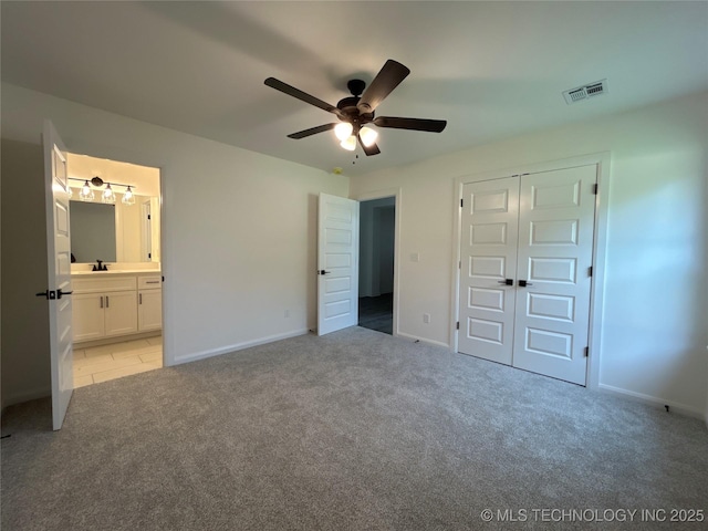 10416 E 132nd St S, Bixby, OK 74008 - unfurnished bedroom featuring light colored carpet, a closet, connected bathroom, and ceiling fan