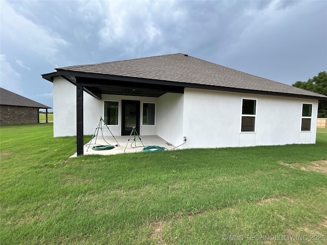 10416 E 132nd St S, Bixby, OK 74008 - back of house featuring a patio area, stucco siding, roof with shingles, and a lawn