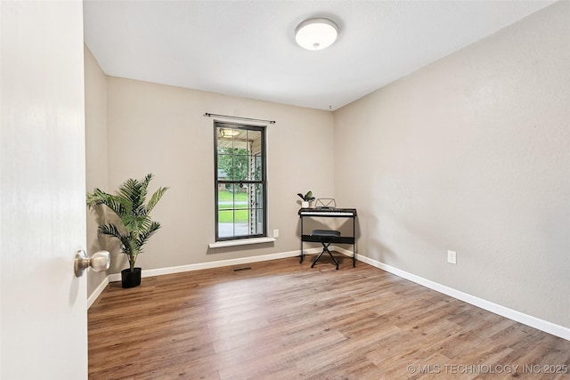 3104 Howard St, Sand Springs, OK 74063 - spare room featuring wood finished floors and baseboards