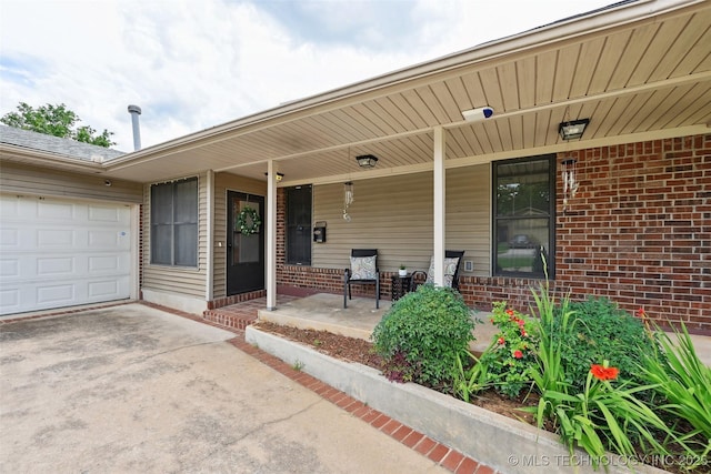 3104 Howard St, Sand Springs, OK 74063 - entrance to property with covered porch, driveway, brick siding, and an attached garage