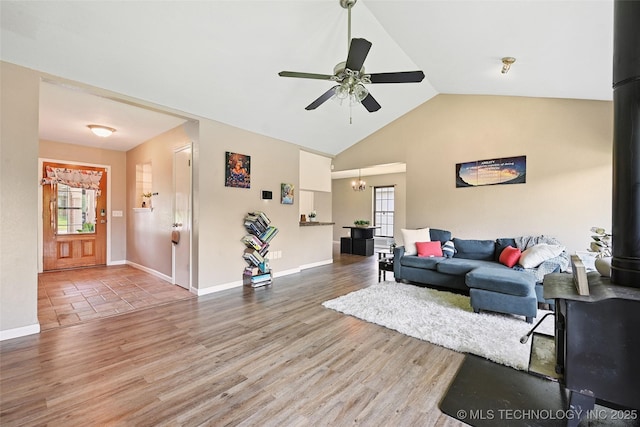 3104 Howard St, Sand Springs, OK 74063 - living area with a ceiling fan, wood finished floors, a chandelier, and high vaulted ceiling