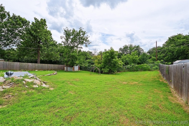 3104 Howard St, Sand Springs, OK 74063 - fenced backyard featuring a shed