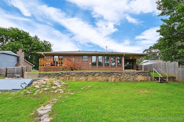3104 Howard St, Sand Springs, OK 74063 - rear view of house with brick siding and a wooden deck