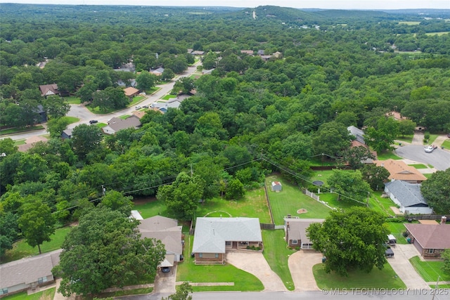 3104 Howard St, Sand Springs, OK 74063 - aerial view of residential area featuring a heavily wooded area
