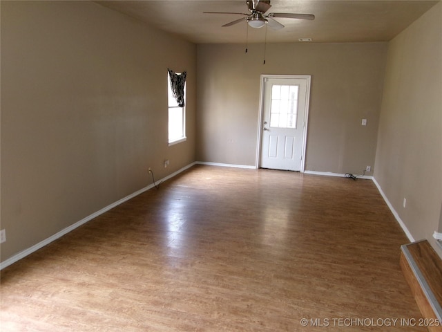 2131 Topeka St, Muskogee, OK 74403 - spare room with ceiling fan, healthy amount of natural light, and wood finished floors