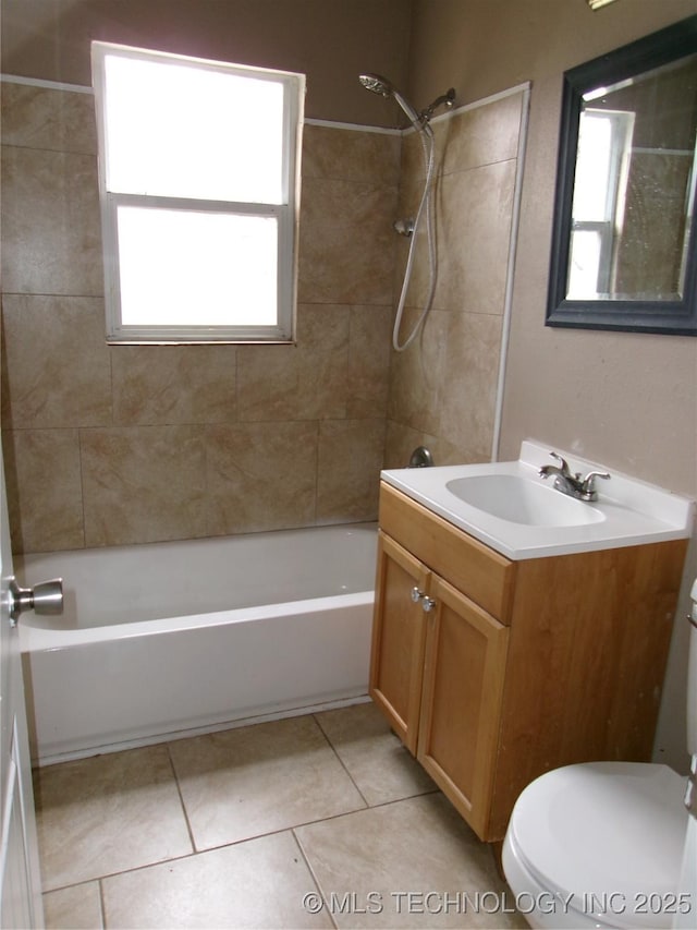 2131 Topeka St, Muskogee, OK 74403 - bathroom with vanity, bathing tub / shower combination, tile patterned flooring, and plenty of natural light