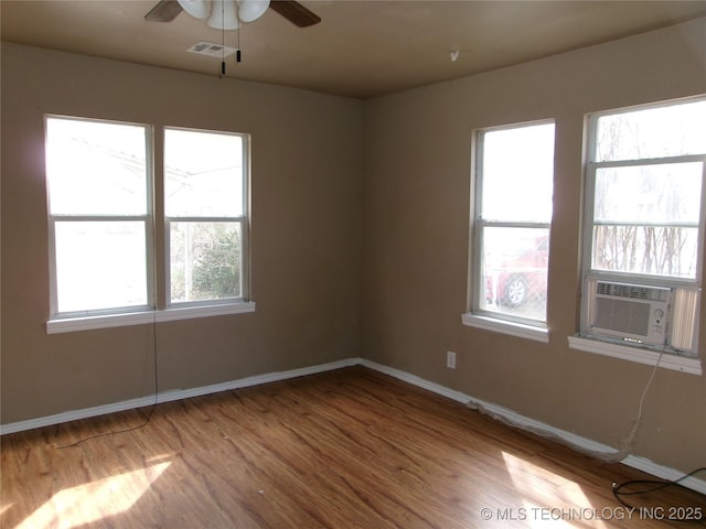 2131 Topeka St, Muskogee, OK 74403 - empty room with wood finished floors and ceiling fan
