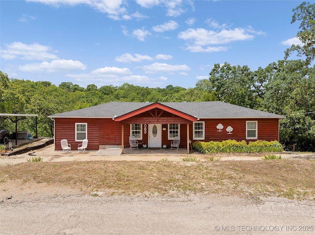 4080 Bud Dr, Sulphur, OK 73086 - view of front facade with covered porch and a shingled roof