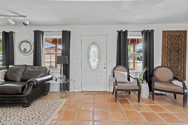 4080 Bud Dr, Sulphur, OK 73086 - foyer with a textured ceiling and light tile patterned floors