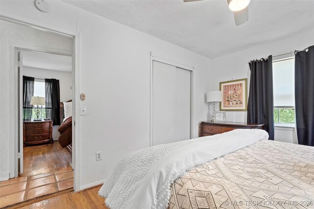 4080 Bud Dr, Sulphur, OK 73086 - bedroom featuring hardwood / wood-style floors, a closet, and a ceiling fan