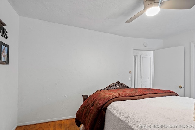 4080 Bud Dr, Sulphur, OK 73086 - bedroom with wood finished floors and ceiling fan