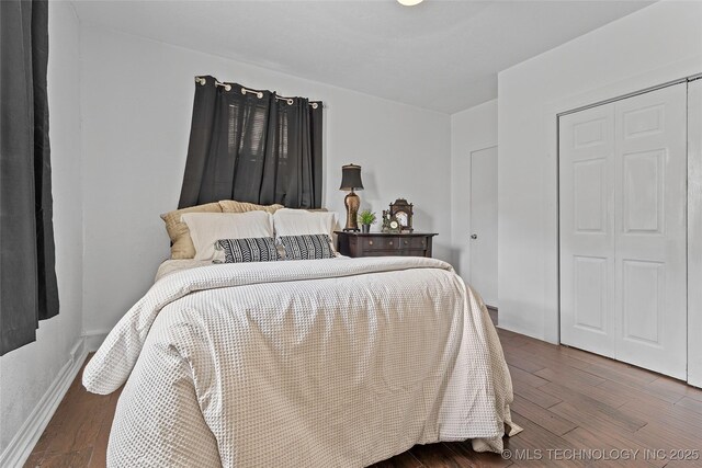 4080 Bud Dr, Sulphur, OK 73086 - bedroom featuring dark wood finished floors and a closet