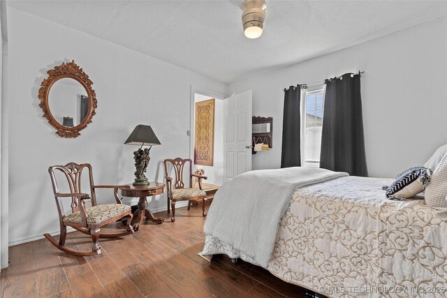 4080 Bud Dr, Sulphur, OK 73086 - bedroom with wood finished floors and baseboards