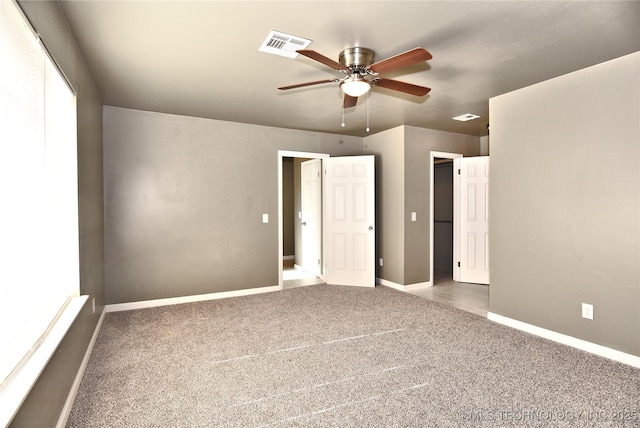 10046 E 29th St, Tulsa, OK 74129 - unfurnished bedroom with carpet floors and a ceiling fan