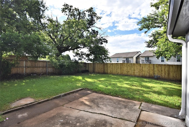 10046 E 29th St, Tulsa, OK 74129 - fenced backyard with a patio area