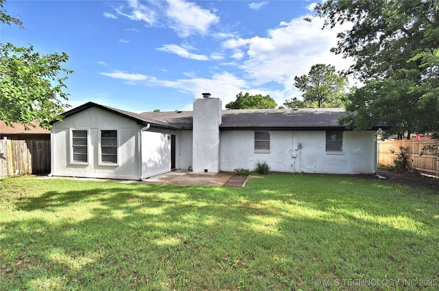 10046 E 29th St, Tulsa, OK 74129 - rear view of property featuring a fenced backyard, a chimney, a patio area, and roof with shingles