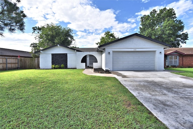 10046 E 29th St, Tulsa, OK 74129 - ranch-style home featuring a garage and concrete driveway