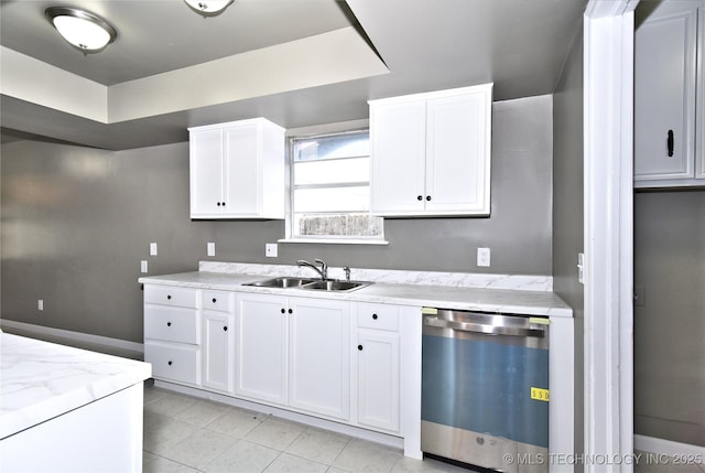 10046 E 29th St, Tulsa, OK 74129 - kitchen with stainless steel dishwasher, white cabinets, light tile patterned floors, and light stone countertops