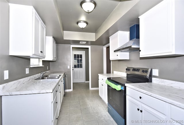 10046 E 29th St, Tulsa, OK 74129 - kitchen featuring electric range, wall chimney exhaust hood, white cabinetry, and light tile patterned flooring