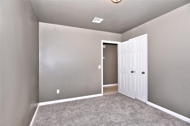 10046 E 29th St, Tulsa, OK 74129 - unfurnished bedroom with carpet floors and a closet