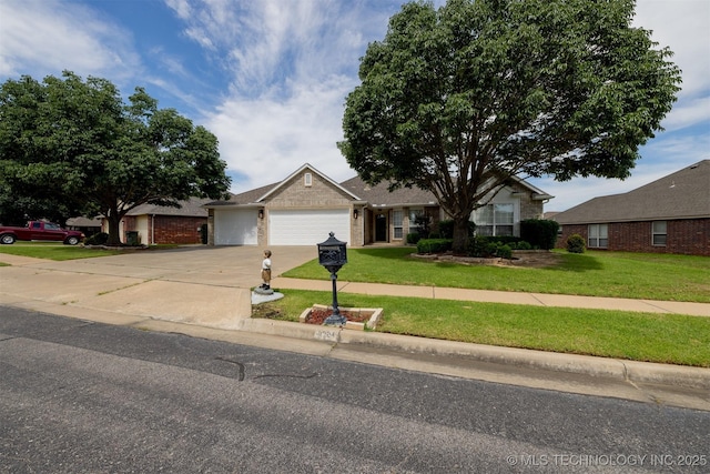 9904 N 102nd E Ave, Owasso, OK 74055 - ranch-style house featuring concrete driveway, a garage, and a front yard