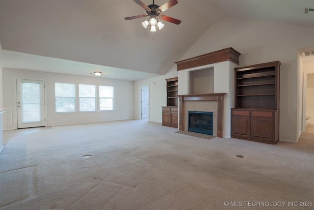 9904 N 102nd E Ave, Owasso, OK 74055 - unfurnished living room with light colored carpet, a tile fireplace, a ceiling fan, and high vaulted ceiling