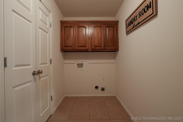 9904 N 102nd E Ave, Owasso, OK 74055 - laundry area featuring washer hookup, hookup for an electric dryer, cabinet space, and light tile patterned flooring