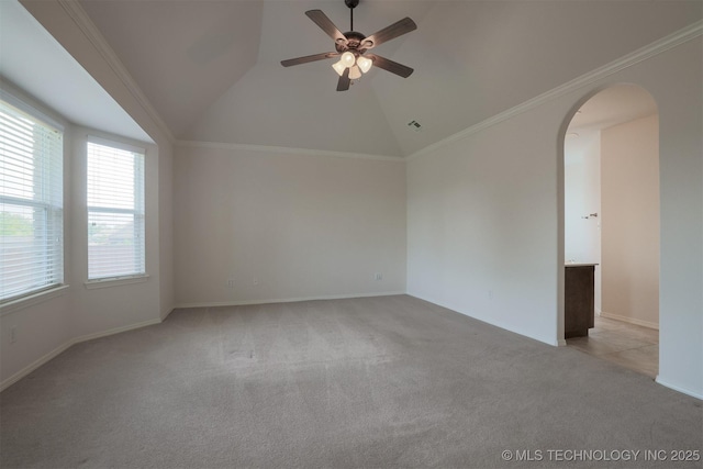 9904 N 102nd E Ave, Owasso, OK 74055 - empty room with light carpet, arched walkways, lofted ceiling, a ceiling fan, and ornamental molding