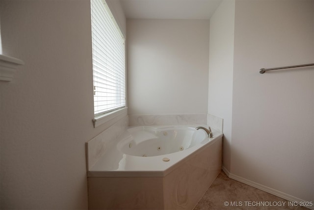 9904 N 102nd E Ave, Owasso, OK 74055 - full bath with a jetted tub and baseboards