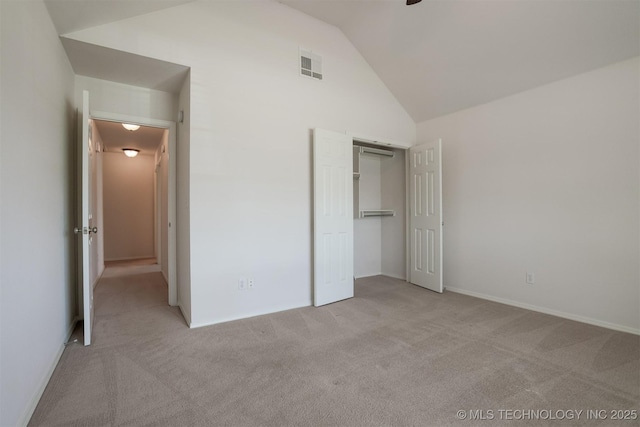 9904 N 102nd E Ave, Owasso, OK 74055 - unfurnished bedroom with light carpet, vaulted ceiling, and a closet