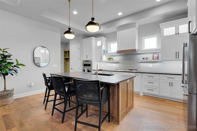 9613 E 119th Ct S, Bixby, OK 74008 - kitchen with tasteful backsplash, recessed lighting, a breakfast bar, dark countertops, and stainless steel appliances