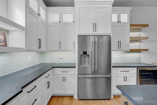 9613 E 119th Ct S, Bixby, OK 74008 - kitchen with high quality fridge, beverage cooler, open shelves, white cabinetry, and backsplash