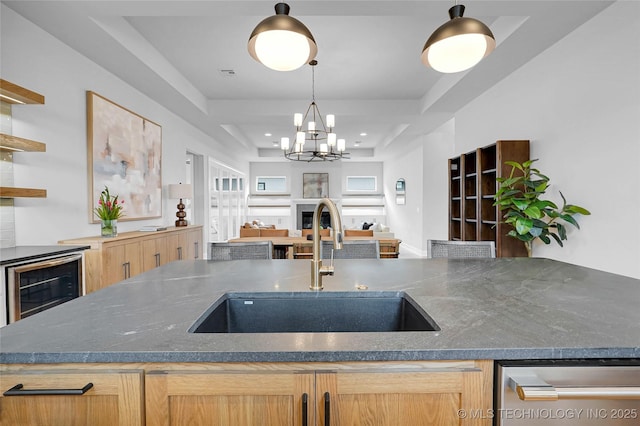 9613 E 119th Ct S, Bixby, OK 74008 - kitchen featuring stainless steel dishwasher, open shelves, open floor plan, a chandelier, and dark stone counters