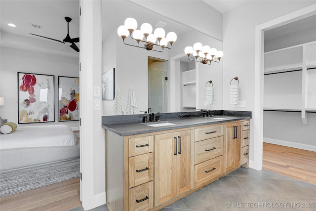 9613 E 119th Ct S, Bixby, OK 74008 - full bathroom with double vanity, a ceiling fan, tile patterned flooring, a chandelier, and recessed lighting