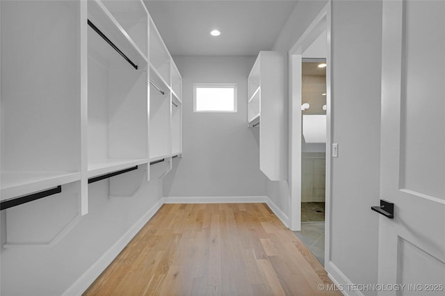 9613 E 119th Ct S, Bixby, OK 74008 - spacious closet with light wood-style flooring