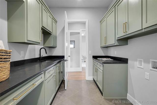 9613 E 119th Ct S, Bixby, OK 74008 - kitchen with green cabinets, dark stone counters, and light tile patterned floors