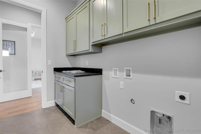 9613 E 119th Ct S, Bixby, OK 74008 - washroom with hookup for an electric dryer, cabinet space, hookup for a washing machine, light tile patterned flooring, and hookup for a gas dryer