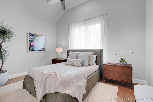 9613 E 119th Ct S, Bixby, OK 74008 - bedroom featuring lofted ceiling and wood finished floors