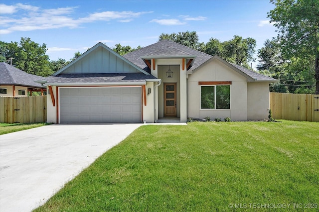 13236 E 4th Pl, Tulsa, OK 74108 - view of front of home with an attached garage, driveway, a shingled roof, and board and batten siding