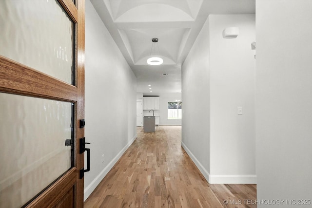 13236 E 4th Pl, Tulsa, OK 74108 - corridor with light wood finished floors and baseboards