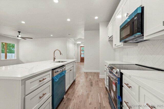 13236 E 4th Pl, Tulsa, OK 74108 - kitchen featuring stainless steel electric range, dishwashing machine, tasteful backsplash, recessed lighting, and white cabinets