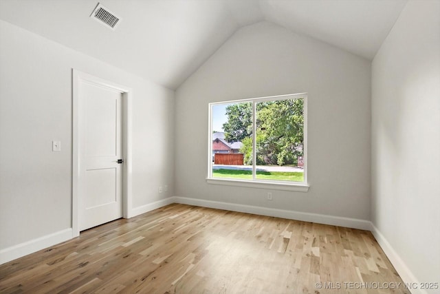 13236 E 4th Pl, Tulsa, OK 74108 - empty room featuring wood finished floors and lofted ceiling
