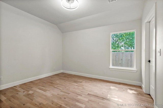 13236 E 4th Pl, Tulsa, OK 74108 - spare room featuring lofted ceiling and light wood-style flooring