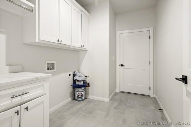 13236 E 4th Pl, Tulsa, OK 74108 - laundry area with cabinet space, hookup for an electric dryer, and hookup for a washing machine